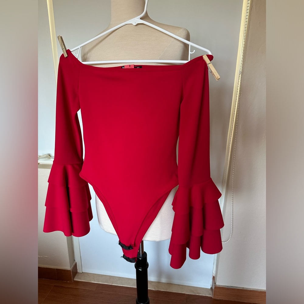 Naasty Gal bodysuit. Red. Flare sleeves. Runs big. Contact for more details.